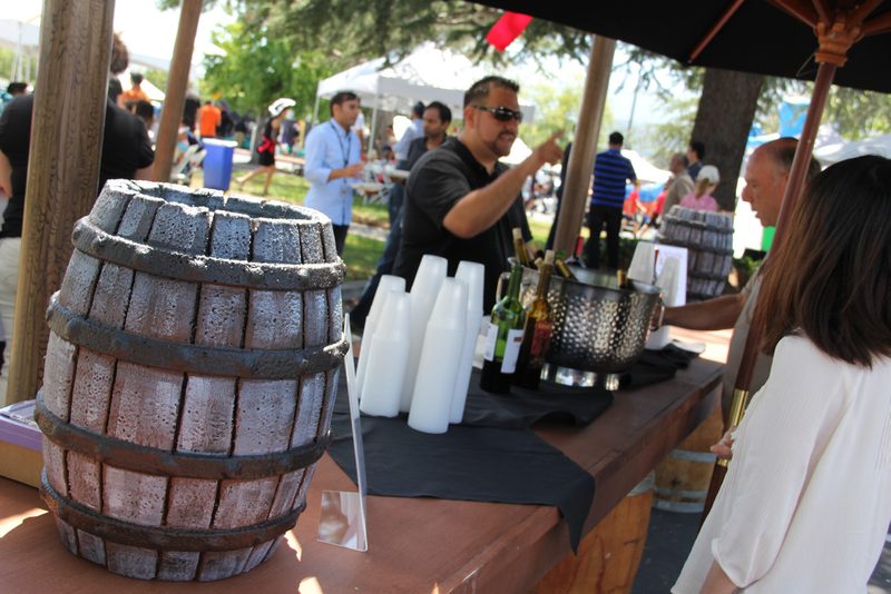 Rustic barrel drink station serving guests at a company event
