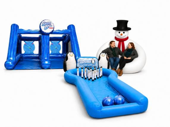 Penguin bowling inflatable Christmas game with snowman lounger for holiday events